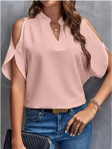 Close-up showing the soft fabric and elegant cold shoulder cut of this pink V-neck blouse