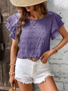 Detail of purple smocked top with double flutter sleeves and round neck