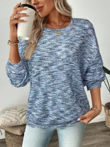 Close-up of a women's colorful waffle knit long-sleeve top with a relaxed fit style