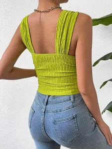 Back view detail of a lime green textured sleeveless crop top with wide straps design.