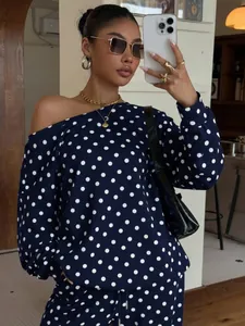Detail of blue and white polka dot loungewear set with an off-shoulder neckline