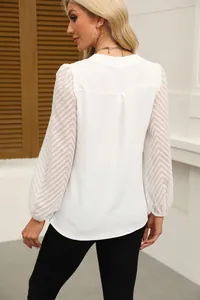 Back view of white chiffon blouse featuring elegant textured lace patchwork sleeves