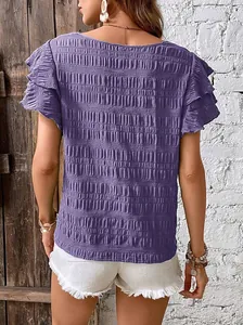 Back view of a textured purple smocked top featuring double ruffle flutter sleeves