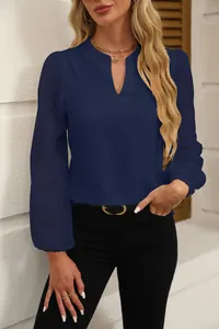 Elegant dark blue V-neck chiffon blouse with detailed lace sleeves shown on a fashion model.