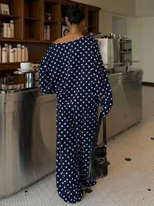 Back view of a polka dot lounge set featuring off-the-shoulder top and wide pants