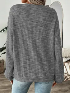 Detailed back view of a grey oversized waffle knit long sleeve T-shirt with casual fit