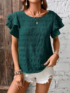 Detailed view of women's dark green textured smocked top with double ruffle sleeves