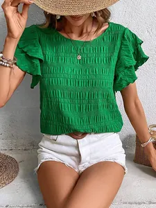 Detailed view of green smocked blouse with elegant double ruffle sleeves for women.