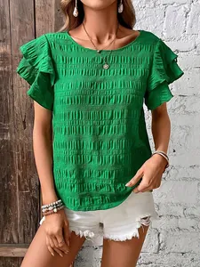 Close-up of vibrant green smocked texture top featuring elegant double ruffle sleeves