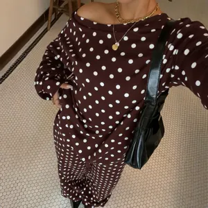 Stylish women's casual polka dot sweatshirt and trousers set with slanted neck design