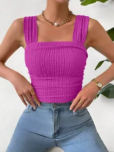 Close-up of a stylish purple smocked crop top with square neckline and wide straps.