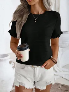 Close-up of black crew neck T-shirt featuring stylish ruffle sleeves and textured fabric