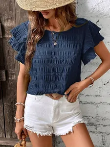 Detailed view of women's navy smocked top with elegant double ruffle sleeves in summer.