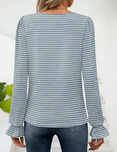 Detailed back view of a blue and white striped long sleeve top with ruffle cuffs