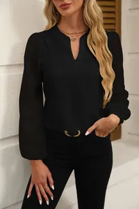 Detailed view of women's black V-neck chiffon blouse with textured lace sleeves