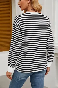 Back view of classic black and white horizontal striped long sleeve loose fit top