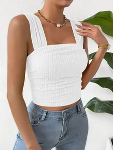 Close-up of white shirred square neck cropped tank top with textured fabric detail