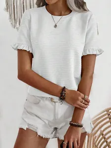 Close-up of white round neck T-shirt with ruffle short sleeves and textured fabric
