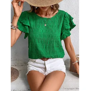 Vibrant green round neck blouse with double ruffled sleeves and smocked texture fabric