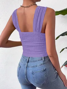 Back view of a purple smocked sleeveless crop top with wide straps and textured fabric.