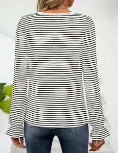 Detailed back view of women's long sleeve striped T-shirt featuring elegant ruffle cuffs