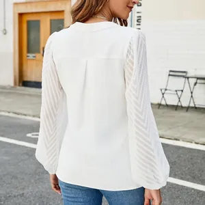 Back view of a white chiffon blouse with elegant chevron lace patchwork sleeves