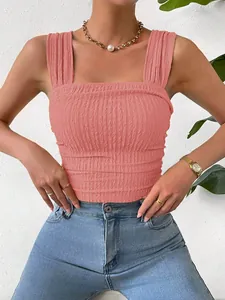 Detailed view of pink ruched sleeveless crop top with square neckline and textured fabric