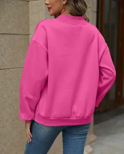 Detailed back view of a vibrant pink fleece-lined loose fit sweatshirt for women.