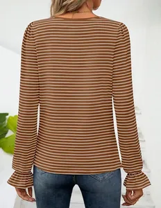 Detail view showing the back of a brown and white striped top with ruffle cuffs.