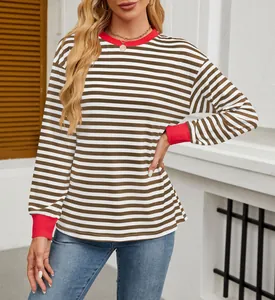 Detailed view of women's striped long sleeve top featuring red contrast collar and cuffs