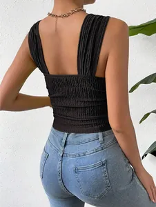 Detailed back view of a black sleeveless square neck crop top with smocked texture