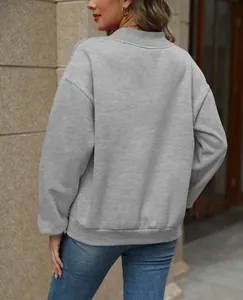 Back view detail of a grey oversized fleece-lined sweatshirt for women's autumn wear