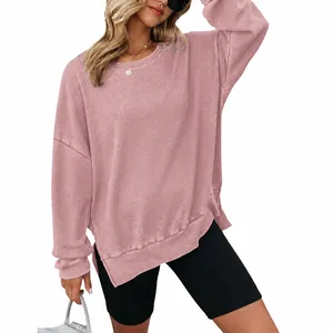 Roze dames sweatshirt met ronde hals, lange mouwen en wafelgebreide stof met split