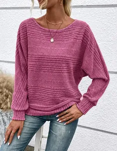 Close-up detail of a pink ribbed knit top featuring stylish batwing sleeves and a crew neck
