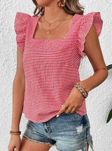Close-up of red and white gingham square neck top with ruffle shoulder details.
