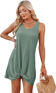 Close-up detail of the green hollow-out knit beach vacation dress with knot hem