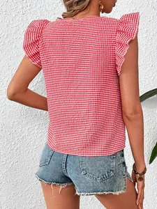 Back view of a red gingham blouse featuring feminine ruffle sleeves and square neckline.