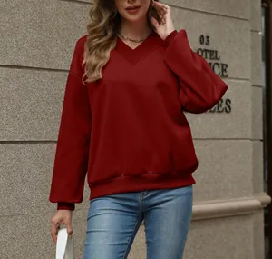 Close-up of red V-neck sweatshirt with fleece lining and ribbed cuffs
