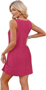 Macro view of the pink sleeveless hollow-out lace texture on a summer beach holiday dress
