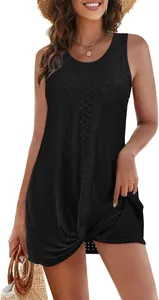 Detail view of a black hollow-out beach cover-up with a stylish twist-knot hem