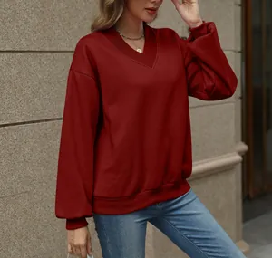 Elegant women's burgundy V-neck loose sweatshirt for a cozy autumn winter casual look