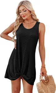 Detailed view of the hollowed-out lace pattern and twisted hem on a black mini dress