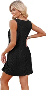 Back view of a black sleeveless mini dress with hollow-out pattern and twist hem detail