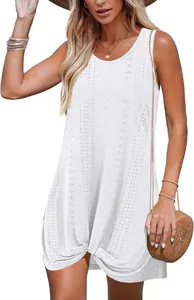 Close-up detail of white hollow cutout beach holiday dress with a stylish twisted knot hem
