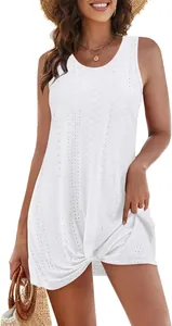 Detail of white hollow-out sleeveless beach dress with front knot design