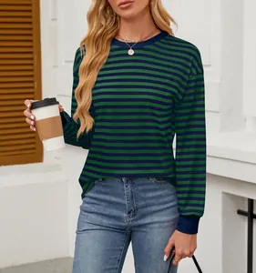 Detail of women's casual loose fit long sleeve top with green and navy striped pattern
