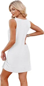 Elegant rear view of a white sleeveless hollow-out crochet mini dress for beach vacations