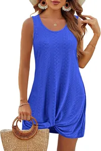 Detail showing blue hollow-out fabric and twist knot hem of this summer beach dress