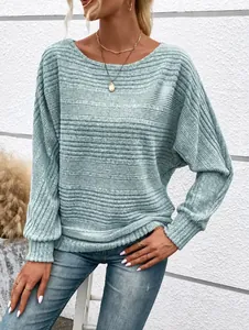 Close-up of light green ribbed knit top with stylish batwing sleeves for women