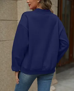 Detailed back view of a casual navy blue oversized sweatshirt with ribbed cuffs and hem.